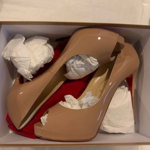 Nude Shoes. Red bottoms.